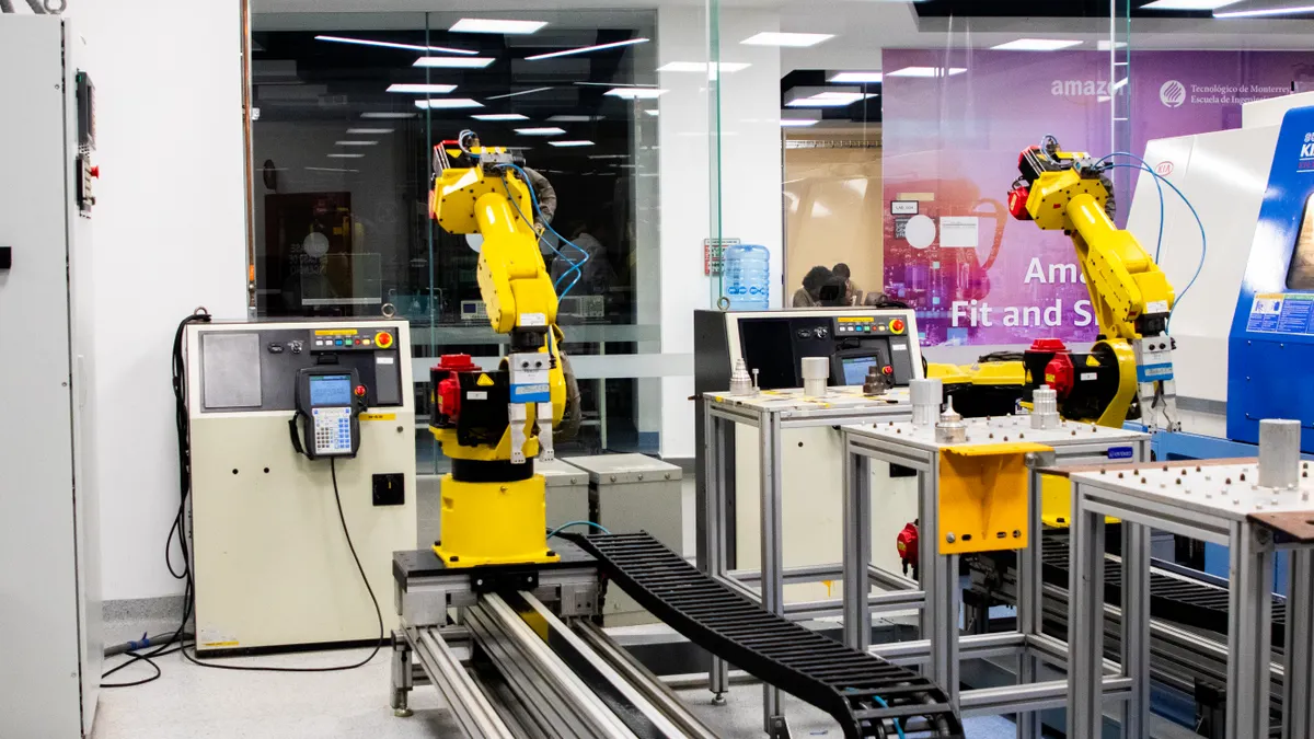Robotic arms working in an automated factory setting
