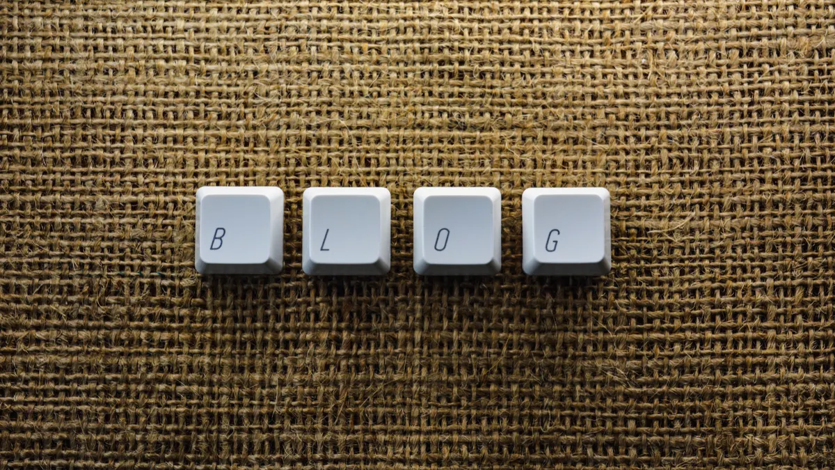 How to Repurpose One Blog Post with AI — Close-up of Individual Keyboard Keys Making a Word "Blog"