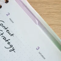 Open planner notebook with handwritten content strategy